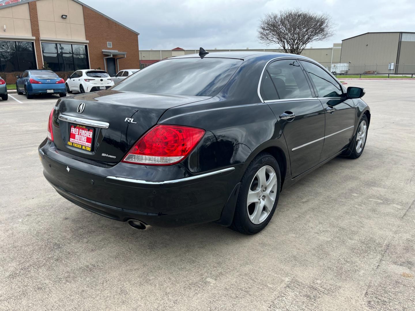 2005 Black /black Acura RL 3.5RL with Navigation System (JH4KB165X5C) with an 3.5L V6 SOHC 24V engine, 5-Speed Automatic Overdrive transmission, located at 14700 Tomball Parkway 249, Houston, TX, 77086, (281) 444-2200, 29.928619, -95.504074 - Photo#6